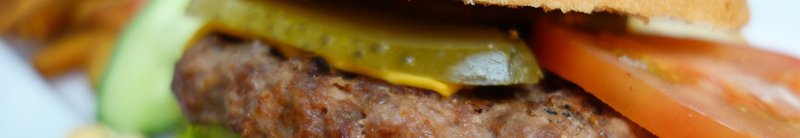 Eating Burger Caribbean at Hungry Joe's Jamaican Restaurant restaurant in Inglewood, CA.